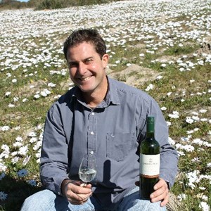 Lukas Wentzel - winemaker at Groote Post in the flowers